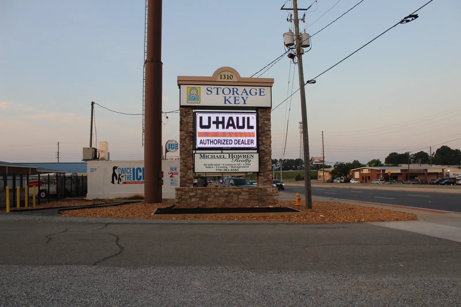 The Storage Key monument sign at the entrance to the Highway 411 location in Cartersville, with the U-Haul Authorized Dealer panel beneath the address.