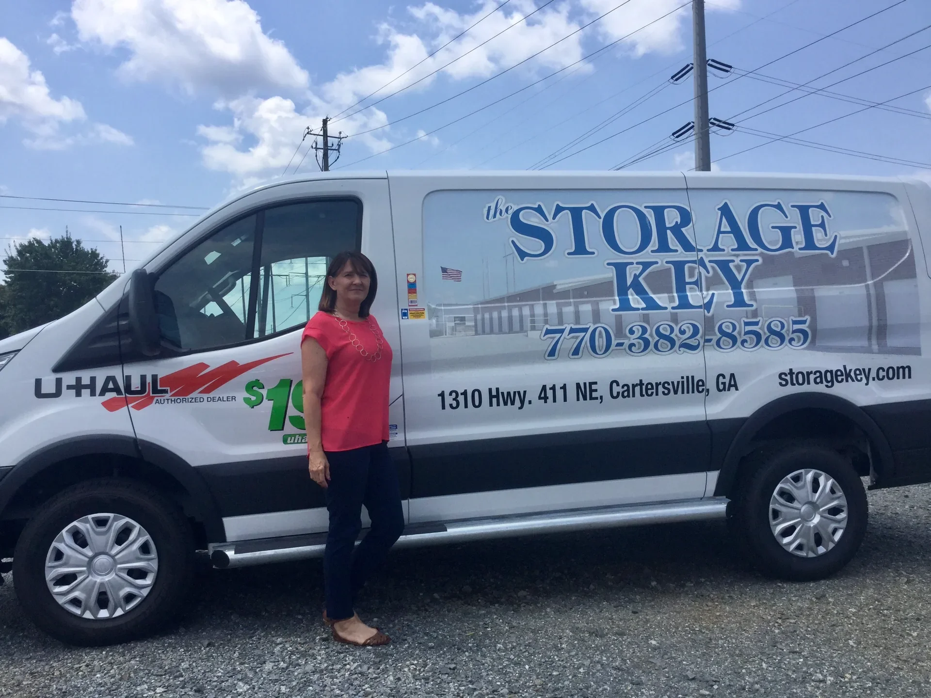 A U-Haul moving truck parked at The Storage Key dealer lot on Highway 411 in Cartersville, Georgia.